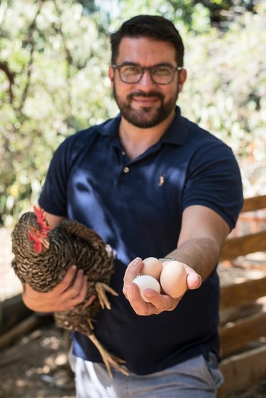Adam Kawalek with chicken and eggs