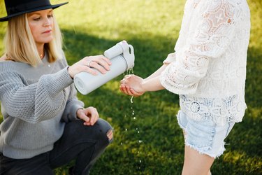 two people washing hands with suds2go