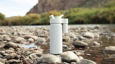 suds2go bottle on riverbed