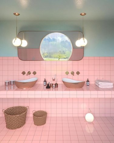 pink tile bathroom countertops with mint walls and pendant lighting