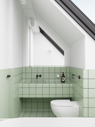 white bathroom with pistachio green tiles and tile countertop