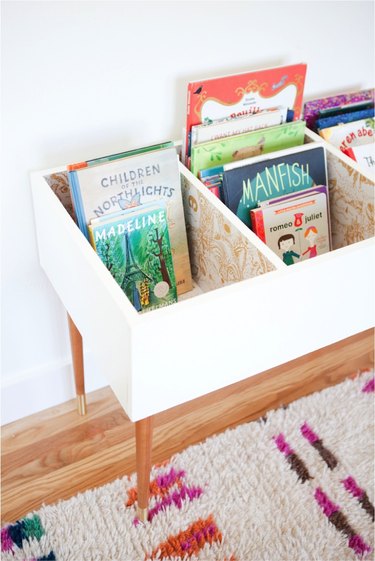 kids book bin lined with removable wallpaper