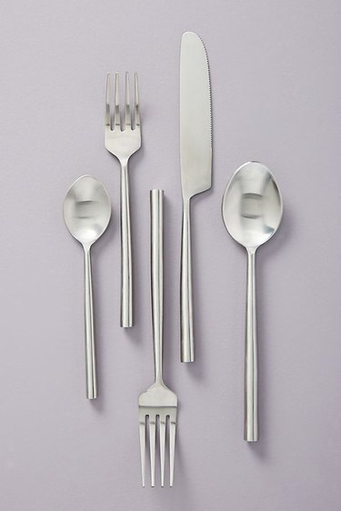 flatware set with forks, knives, and spoons