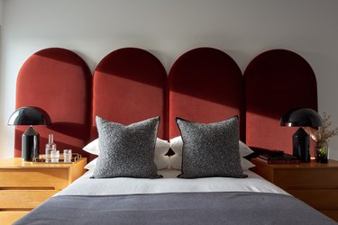 bedroom with red velvet headboard