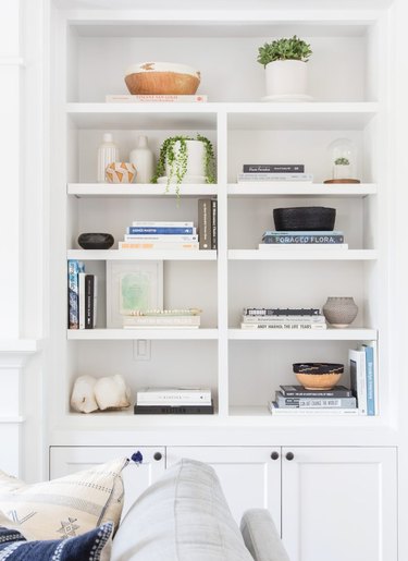 How to Use Decorative Accents to Style a Bookshelf