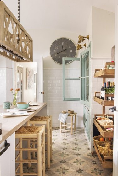 white rustic kitchen with aqua cabinet and wood furniture
