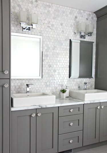 white bathroom cabinets with dark countertops