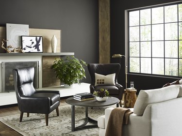 sherwin-williams Urbane Bronze paint on walls in living room with chairs, sofa, and coffee table