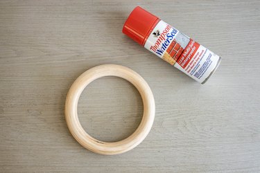 Wooden ring sprayed with waterproofing sealant