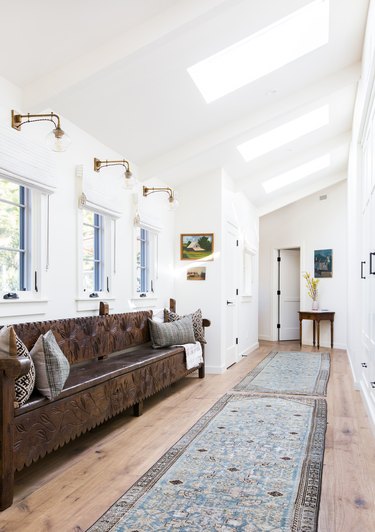 Skylights and windows flood a hallway in Ojai with light.