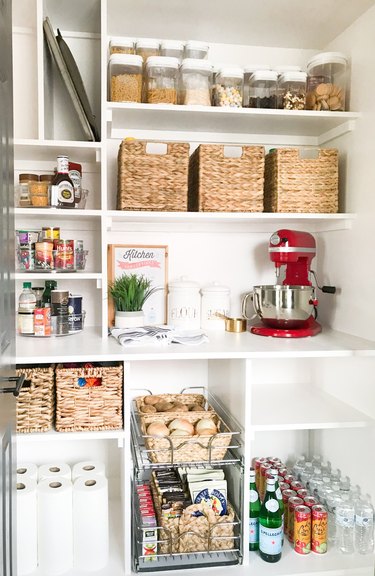 organized small pantry closet with custom shelving