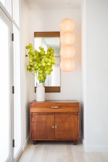 A California modern hallway loses a closet but gains a style statement.