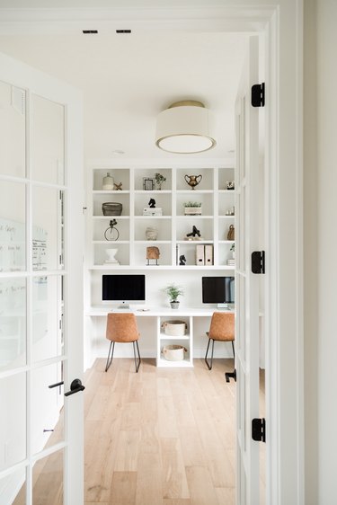 white Contemporary Office with double desk and open shelving