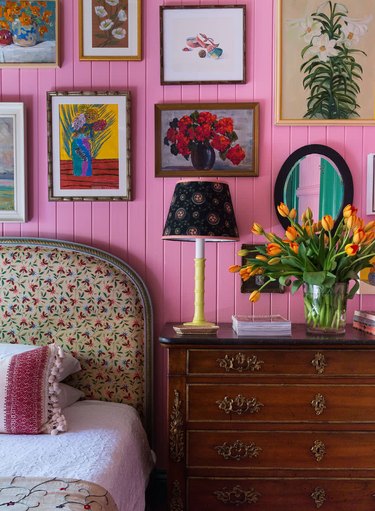 country bedroom idea with pink wooden panelling in eclectic bedroom