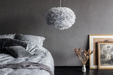 bedroom lighting idea with textured pendant next to bed