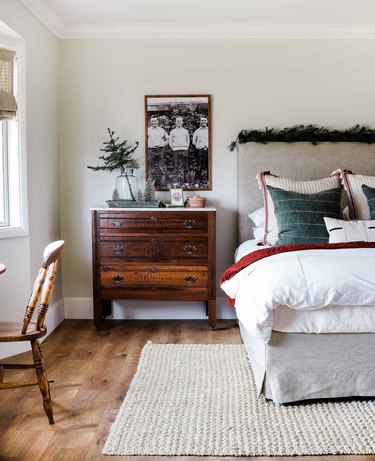 beige bedroom with bed with red and green Christmas colors