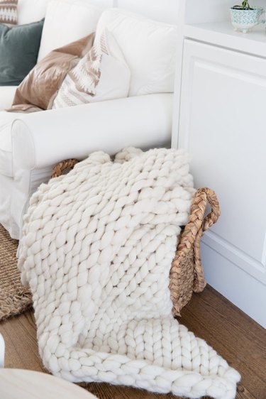 small living room idea for storage with basket for blankets