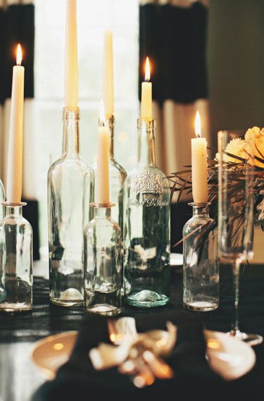 repurposed wine bottles turned into candleholders