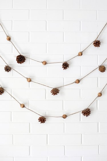 festive fall pine cone and wooden bead garlands