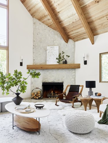 living room with plush rug and fireplace