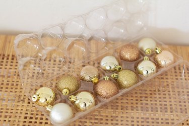 Small ornaments stored inside egg carton