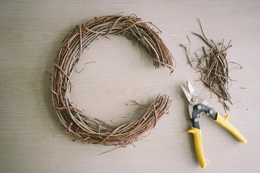 Three-inch segment cut off of grapevine wreath with garden shears