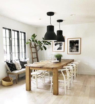 House Seven Design dining room with black industrial pendants and rustic table