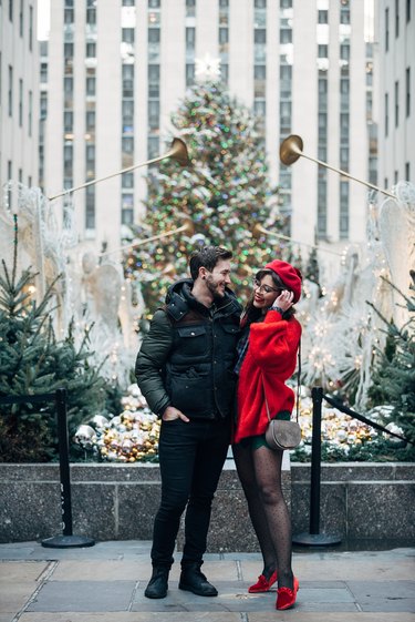 professional holiday photos in front of Christmas tree