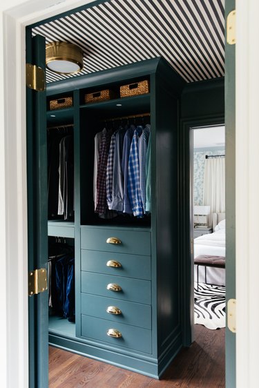 Ikea Hack bedroom closet idea by Erin Kestenbaum with green cabinetry and striped ceiling