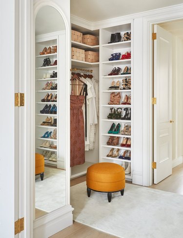 bedroom closet idea with shelving for shoes and clothes hanging on rod with open shelving above