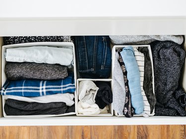 bedroom closet idea with boxes inside drawers to organize clothes