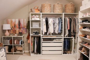 Walk-In bedroom closet idea by Blogger Lauren Loves with shelving, drawers, nooks, baskets and hanging clothes