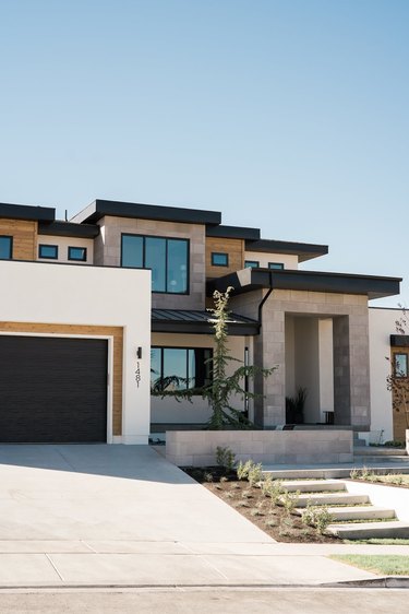 Contemporary home exterior with stonework and geometric details