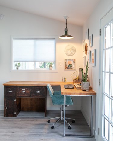 Garage office with corner desk and pendant light