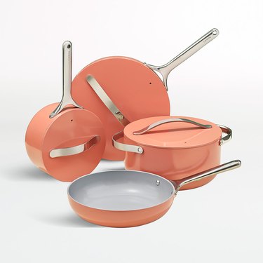 peach-colored ceramic pots and pans set
