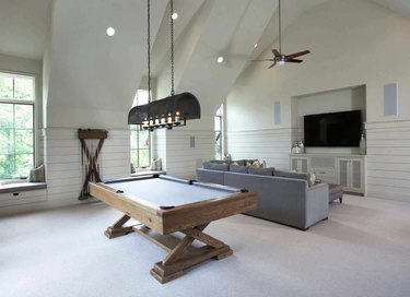 sophisticated game room for bonus room above garage idea