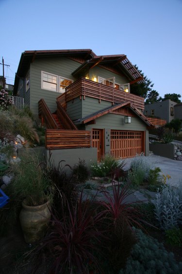 craftsman style garage door and green exterior