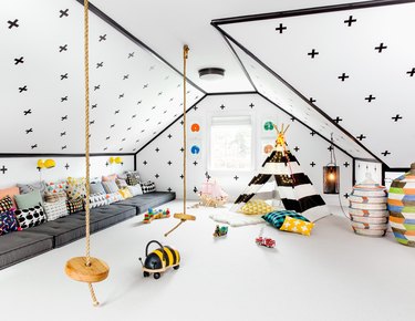 whimsical playroom with rope swings for bonus room above garage idea