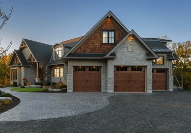 craftsman style garage doors with windows and warm wood finish