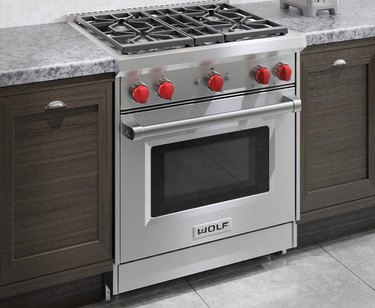Slide-in Stainless Steel Gas Stove with red knobs