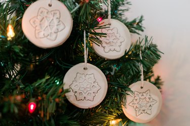 Allow the clay ornaments to dry before hanging.