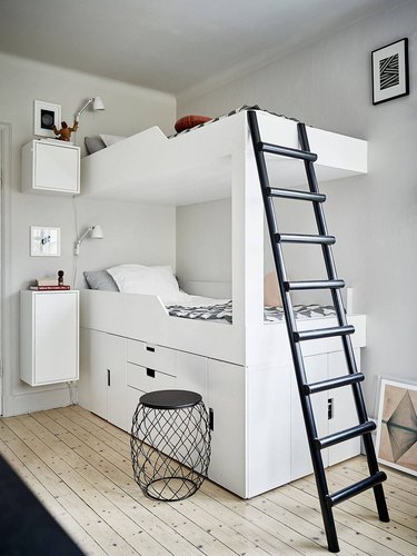 white bedroom with black accents and bunk beds