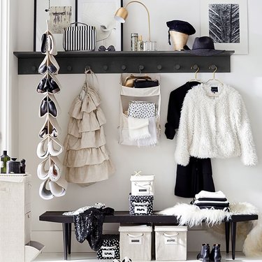 Purses peeking from a hanging organizer