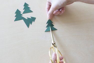 Cutting vertical slit in paper Christmas tree
