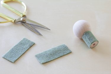 Gluing felt around wood spool