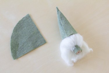 Gluing felt in cone shape on top of gnome's head