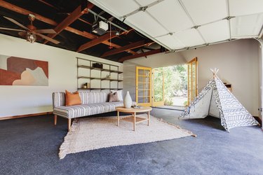 Small Garage Ideas with gray floor, art, striped sofa, and fort