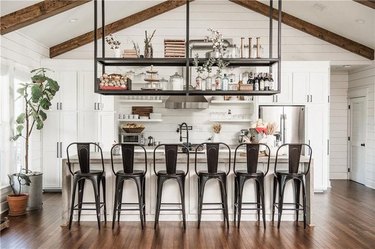 farmhouse kitchen with black chairs