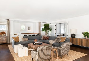 rustic living room lighting idea in open floor plan with sectional sofa