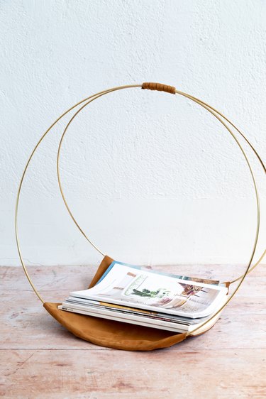 DIY Magazine Rack using gold macrame hoops and leather